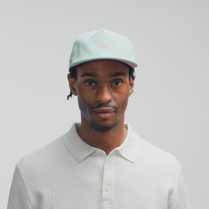 The model-image view of the melin Split Crushed Fit Eagle Hydro hat in South Beach