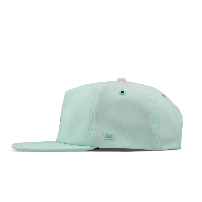 The side view of the melin Split Crushed Fit Eagle Hydro hat in south beach