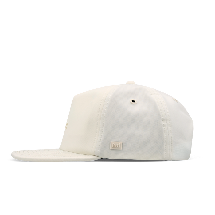 The side view of the melin Split Crushed Fit Eagle Icon Hydro hat in egret