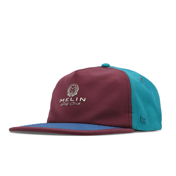 The front, angled view of the melin Split Crushed Fit Eagle Links Clubhouse Hydro hat in grandeur