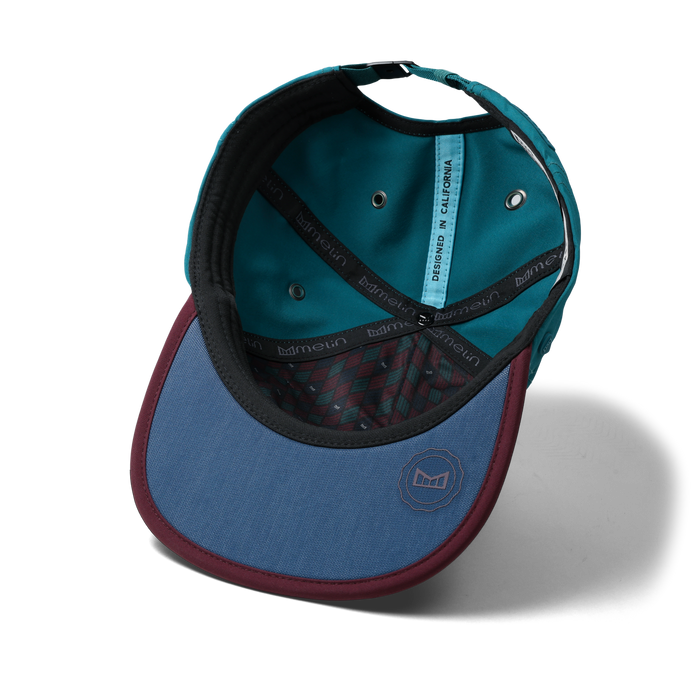 The inside view of the melin Split Crushed Fit Eagle Links Clubhouse Hydro hat in grandeur