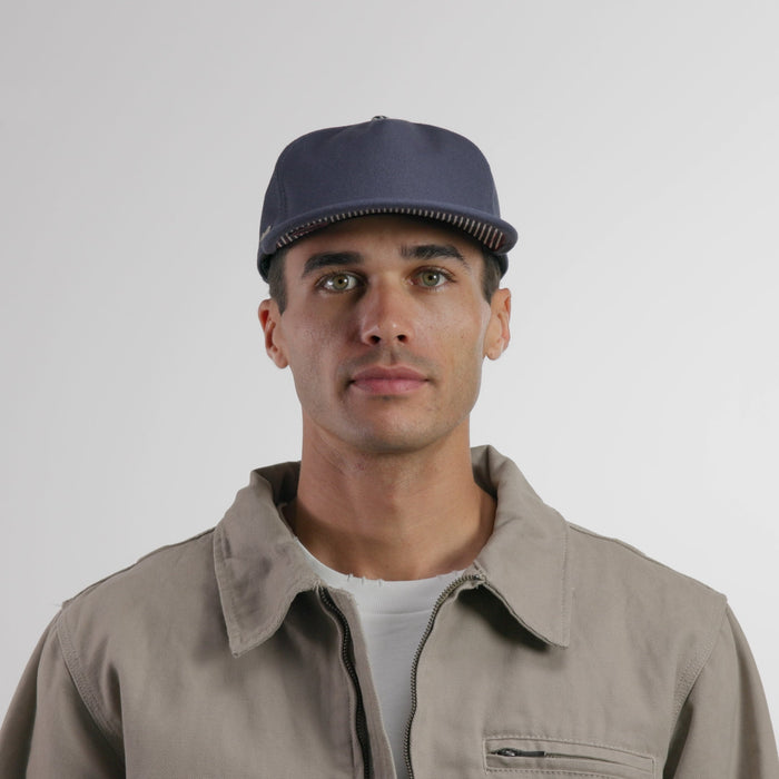 The model-image of the melin Split Crushed Fit Eagle Mill Union hat in hickory denim