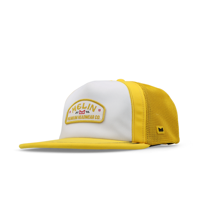 The angled view of the melin Split Crushed Fit Eagle MPH Pit Crew Hydro hat in golden