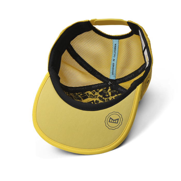 The inside view of the melin Split Crushed Fit Eagle MPH Pit Crew Hydro hat in golden