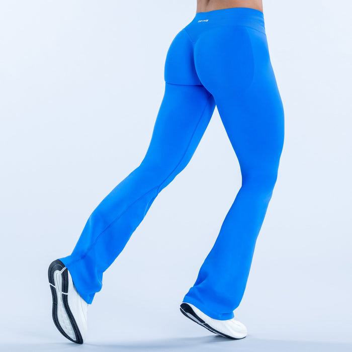 Blue flare athletic leggings, side view, flared leg opening
