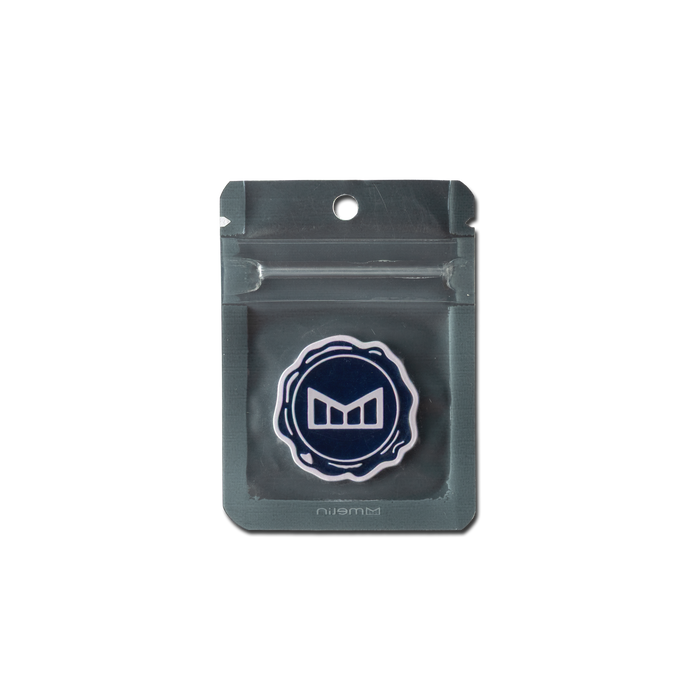 melin Icon Ball Marker in Navy/White, shown in its packaging