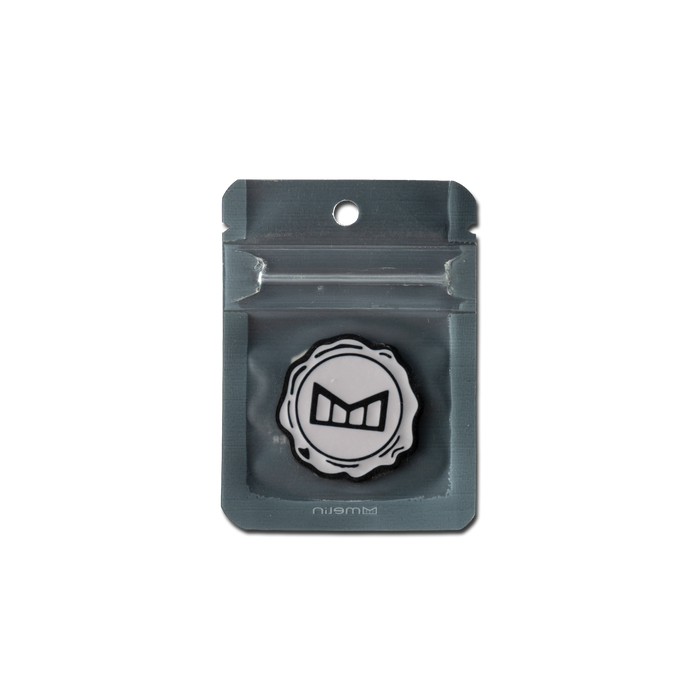 melin Icon Ball Marker in White/Black, shown in its packaging