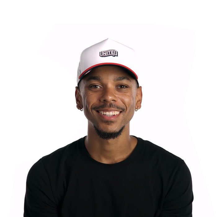 The model-image of melin's Odysea Americana Hydro snapback hat in White / Red / Navy