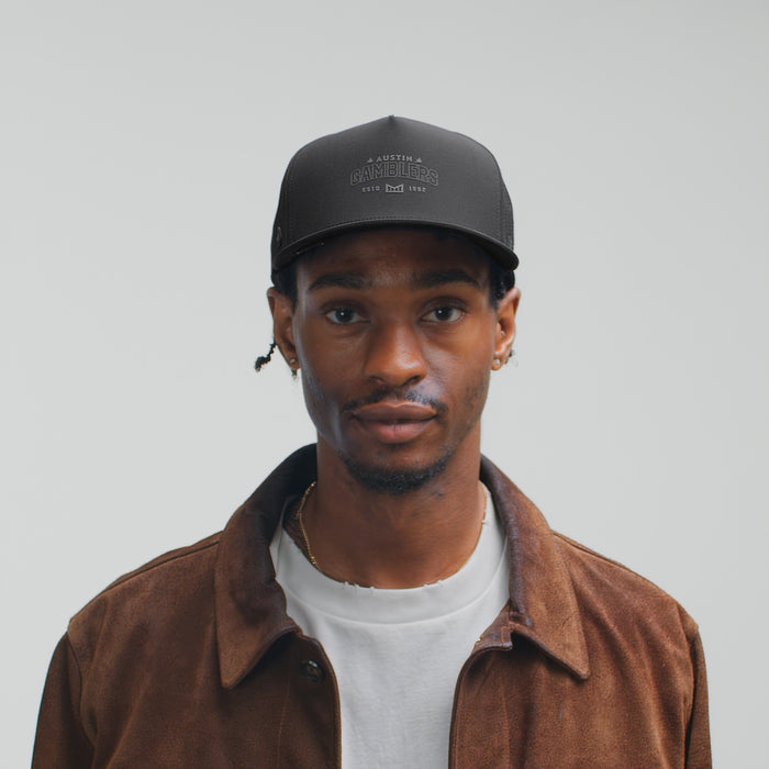 The model-image view of the melin Split Fit Odysea Austin Gamblers Hydro hat in Black