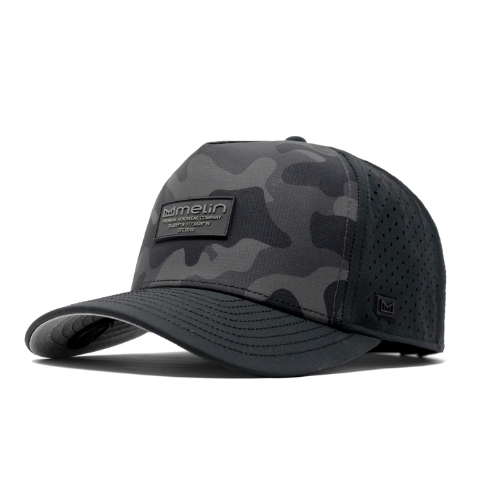 The angled view of the Melin Split Fit Odyssey Brick Hydro hat in black camo midnight