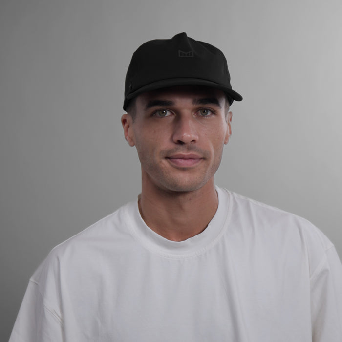 The model-image view of the melin Split Fit Odysea Hydro VO2 hat in Shadow