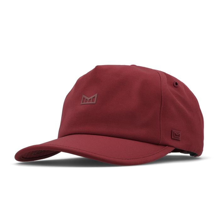 The angled view of the melin Odysea Hydro VO2 hat in Tawny Port