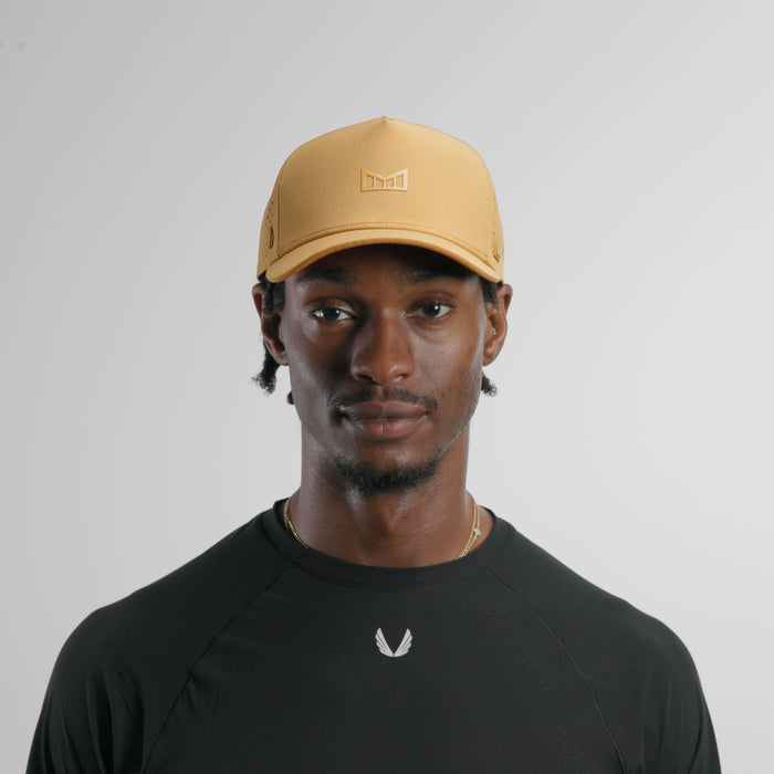 The model-image of the melin Split Fit Odysea Hydrolite hat in medal bronze