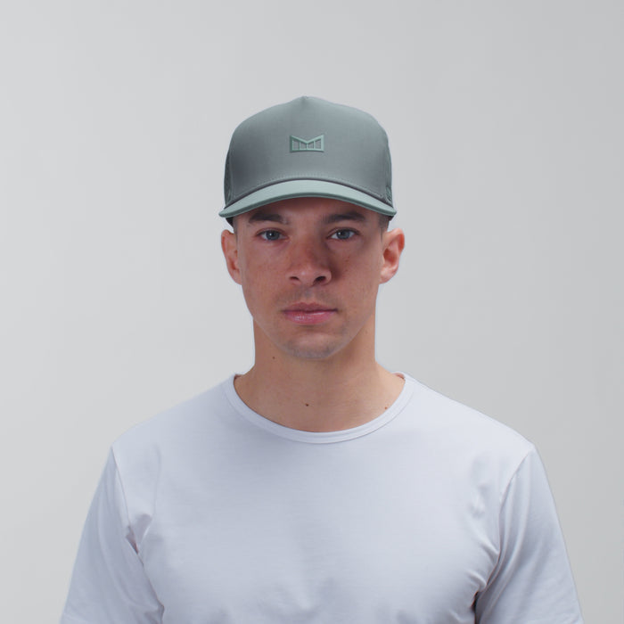 The model-image view of the melin Split Fit Odysea Hydrolite hat in Stormy Blue