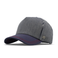 The angled view of the melin Split Fit Odysea Mill Union hat in hickory denim