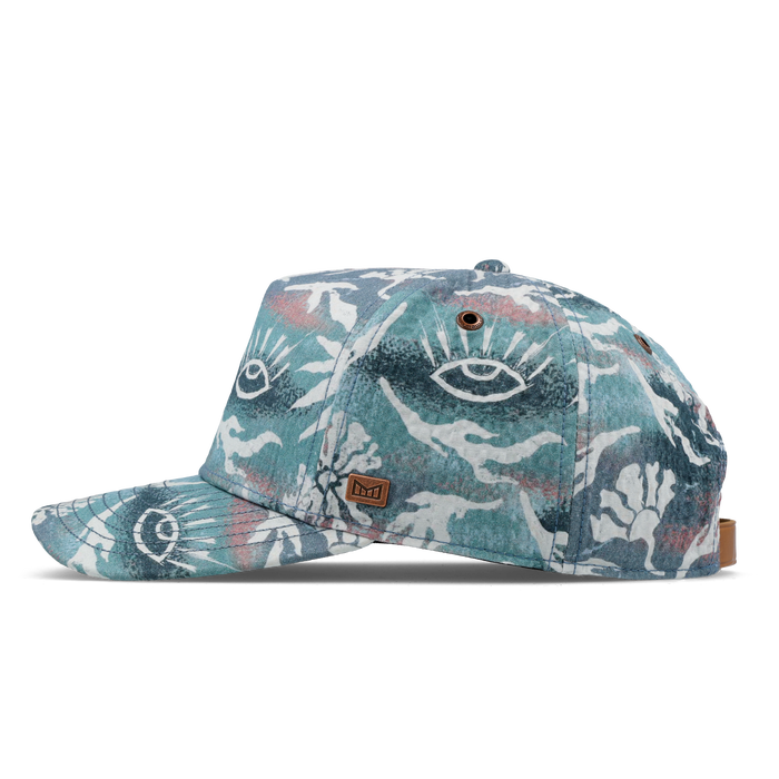 The side view of the melin Split Fit Odysea Mill Visions hat in marine