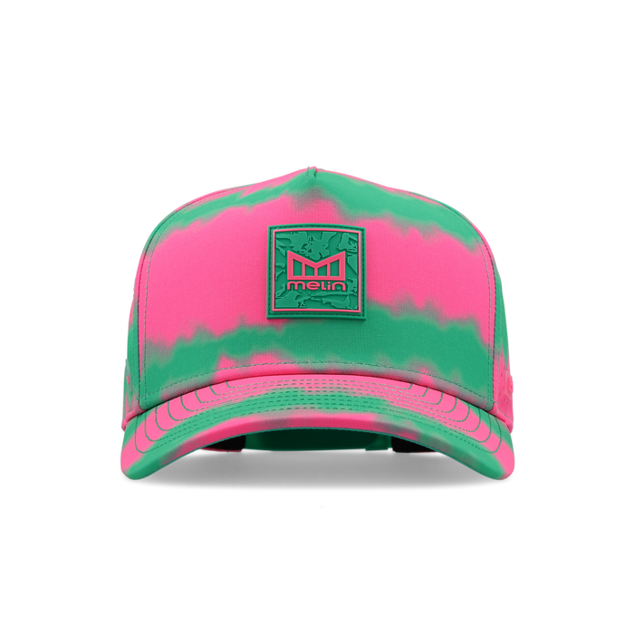 Baseball cap with neon pink and green tie-dye pattern and embroidered logo patch on front.