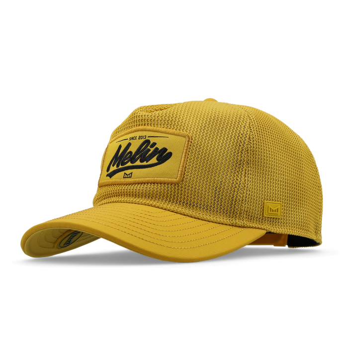 The angled view of the melin Split Fit Odysea Retro Hydro hat in golden
