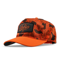 The angled view of the melin Split Fit Odysea Retro Hydro hat in safety orange