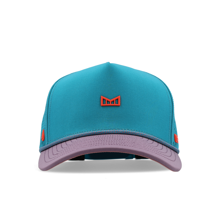 Turquoise and lavender baseball cap with red bull icon emblem on front.