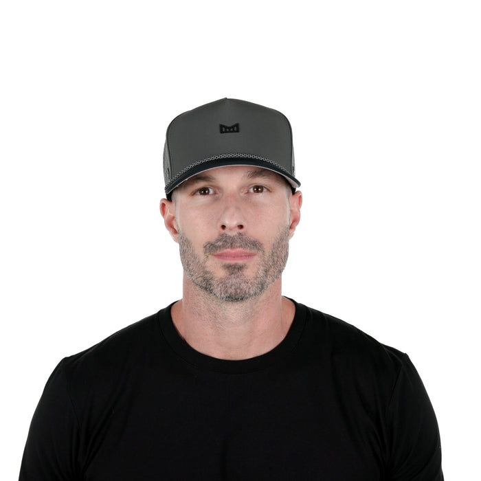 The model-image of melin's Odyssey Rope Bulls Icon Hydro hat - Charcoal / Black