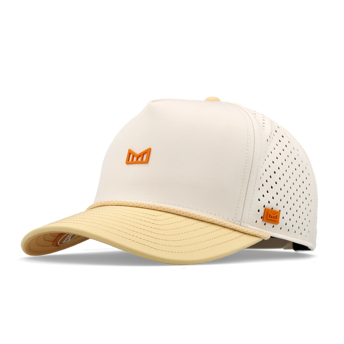 Cream and yellow baseball cap with perforated mesh back panel and small orange bull logo on front and side.