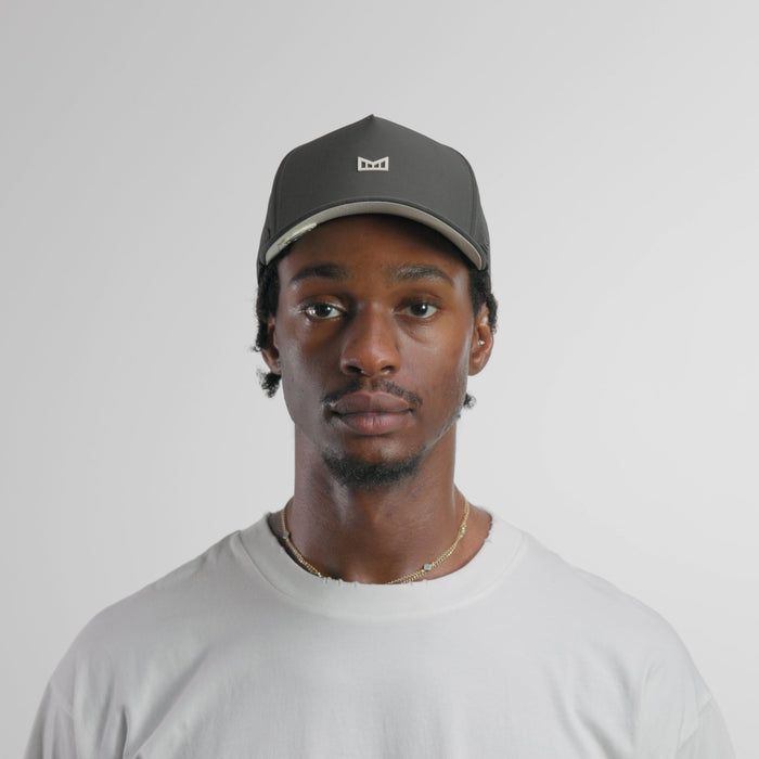 The model-image of the melin Split Fit Odysea Rope Bulls Icon Hydro hat in faded black