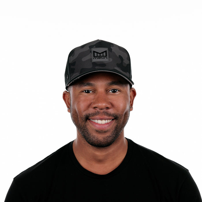 The model-image of the Melin Split Fit Odysea Stacked Hydro hat in Black Camo