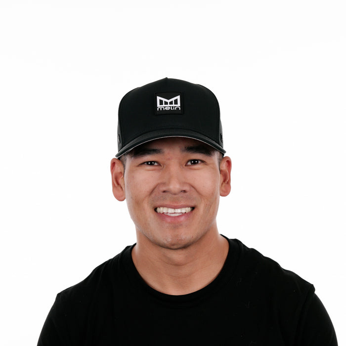 The model-image view of the Melin Split Fit Odysea Stacked Hydro hat in Black