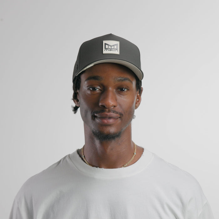 The model-image of the melin Split Fit Odysea Stacked Hydro hat in faded black