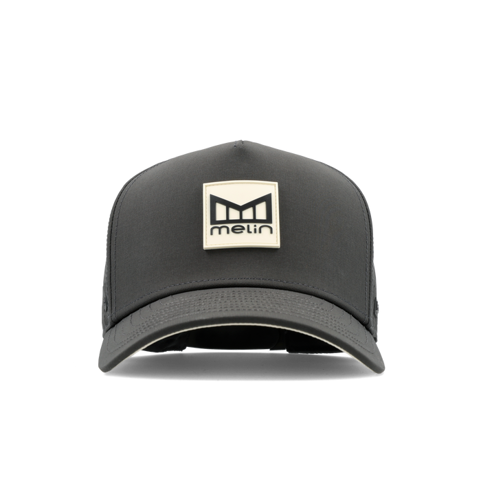 The frontal view of the melin Split Fit Odysea Stacked Hydro hat in faded black