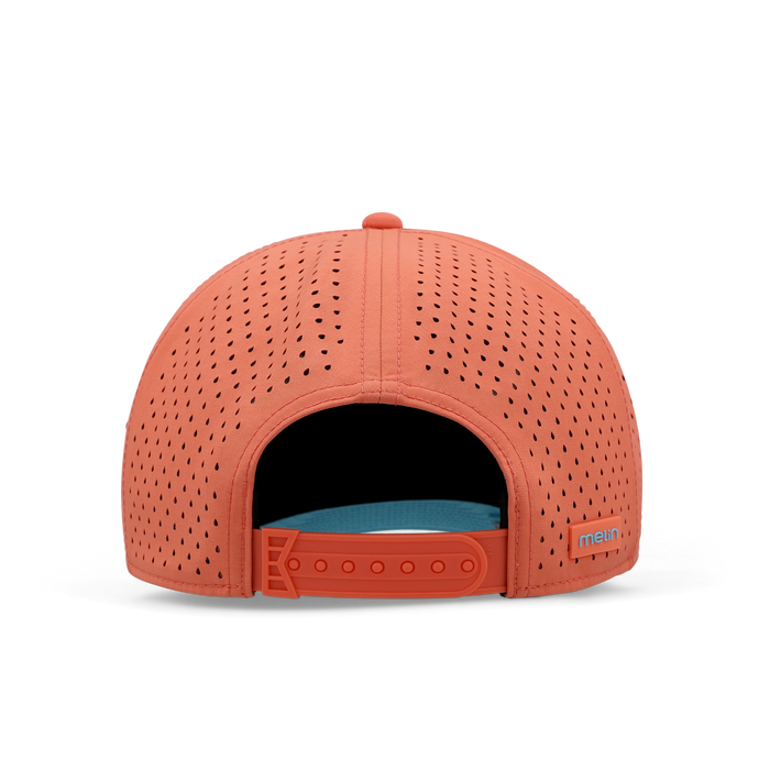 Hot coral perforated cap with blue interior lining and adjustable snapback closure.