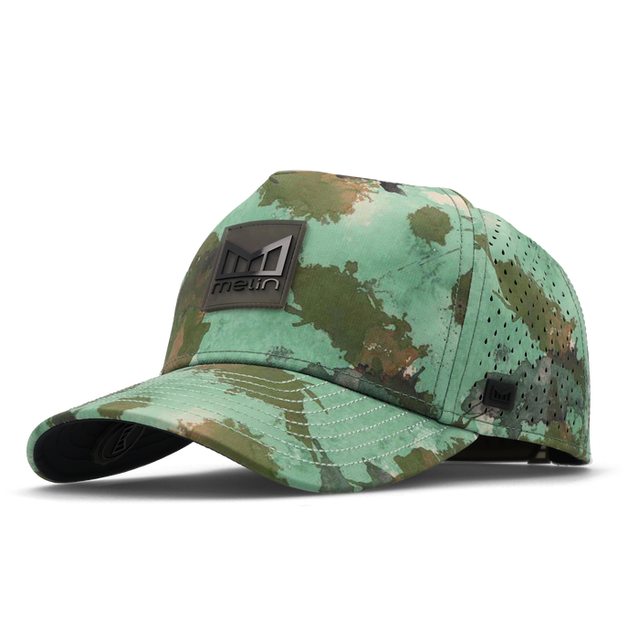 The angled view of the melin Split Fit Odysea Stacked Hydro hat in watercolor camo