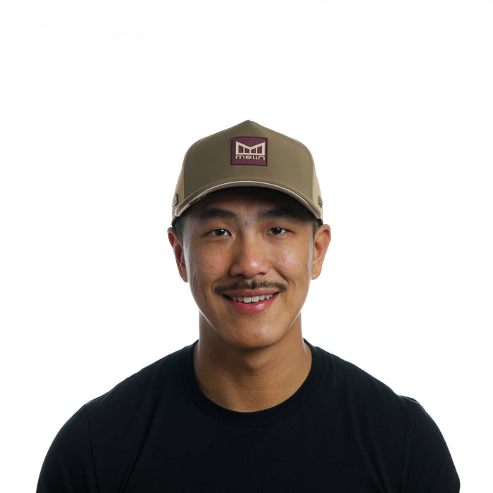 The model-image of the Melin Split Fit Odysea Stacked Infinite Thermal hat in Dark Olive / Fig