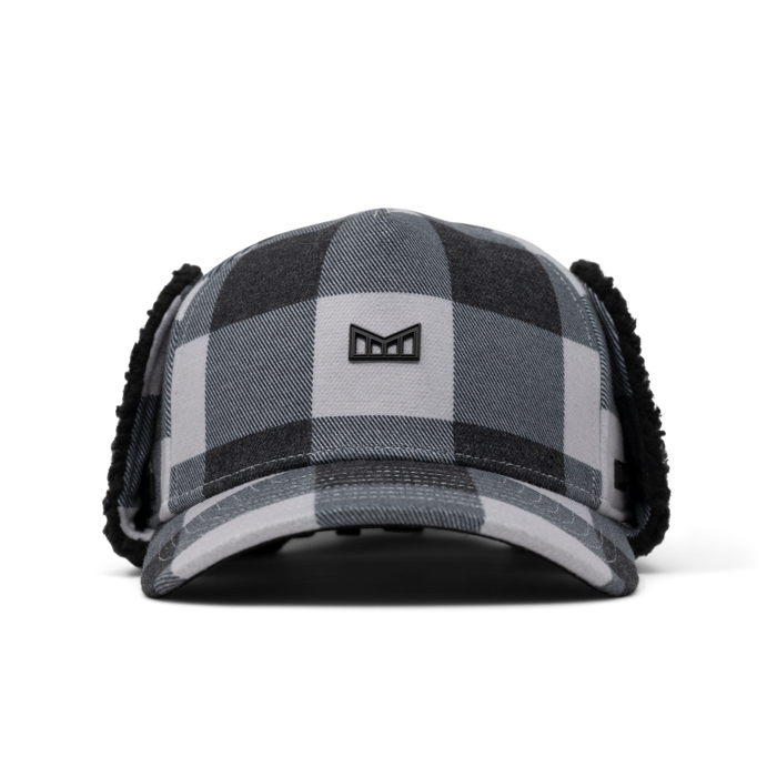 Black and white plaid thermal cap with ear flaps and embroidered logo on front.