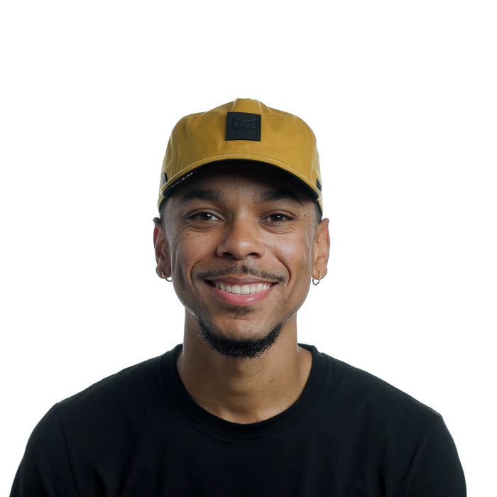 The model-image of the Melin Split Fit Odyssey Stacked Thermal hat in British Khaki