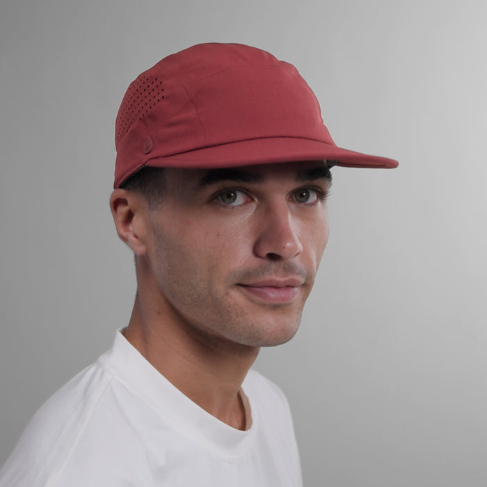 The model-image view of the melin Camper Fit Pace Hydro VO2 hat in Tawny Port