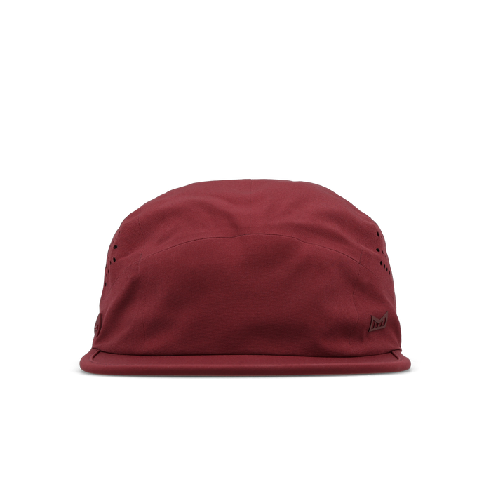 The frontal view of the melin Pace Hydro VO2 hat in Tawny Port