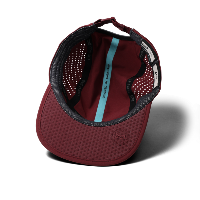 The inside view of the melin Pace Hydro VO2 hat in Tawny Port