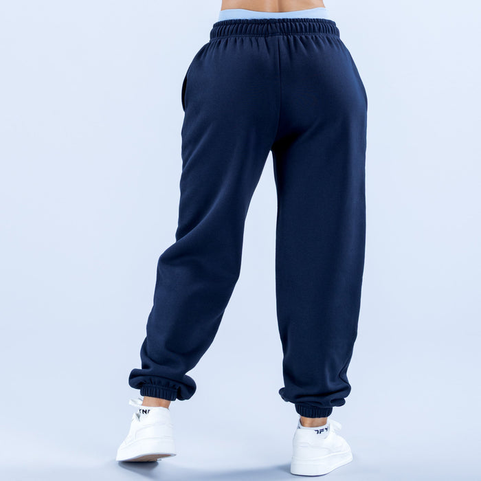 Navy joggers, back view with elastic waistband and ribbed ankle cuffs.