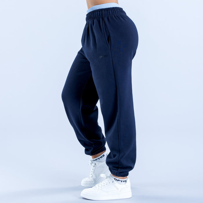 Navy joggers with elastic waistband, relaxed taper, ribbed ankle cuffs.
