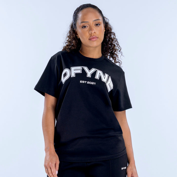 Black oversized graphic tee with large white DFYN logo, crew neck