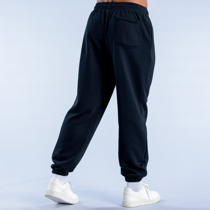 Dark cuffed jogger pants, side seam pockets and elastic cuffs at ankles