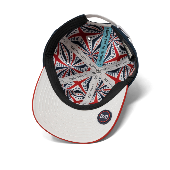 The inside view of the melin The Legend Americana Hydro Performance Dad Hat in white / red / navy