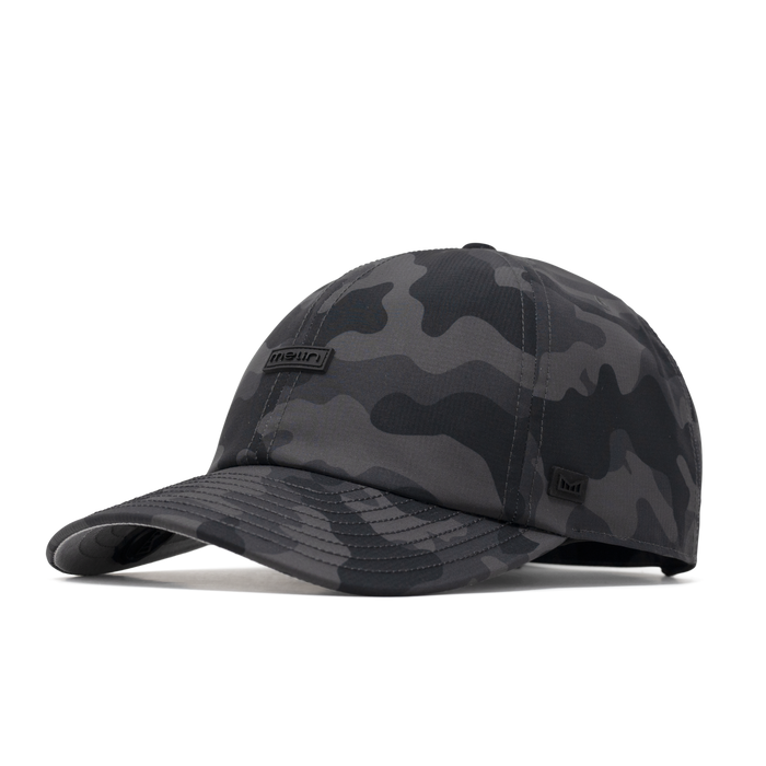 The front, angled view of the melin The Legend Hydro  Performance Dad Hat in  Black Camo