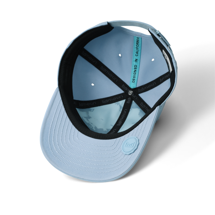 The inside view of the melin The Legend Hydro  Performance Dad Hat in  Cashmere Blue