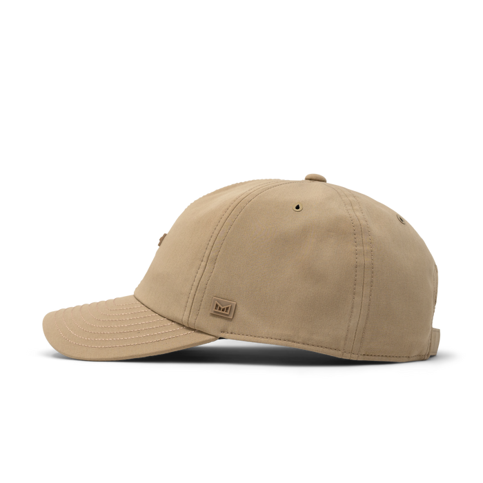 The side view of the melin The Legend Hydro Performance Dad Hat in dark khaki