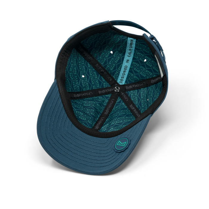 The inside view of the melin Performance Dad Hat The Legend Hydro  in Deep Dive
