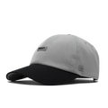 The front, angled view of the melin The Legend Hydro  Performance Dad Hat in Heather Grey / Black