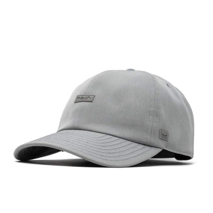 The angled view of the melin The Legend Hydro Performance Dad Hat in heather grey